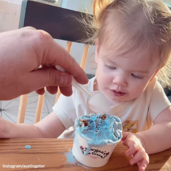 Dad Sneaks a Bite of Daughter's Ice Cream