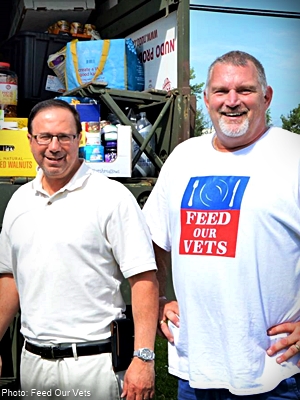 Feed Our Vets volunteers in front of a food delivery