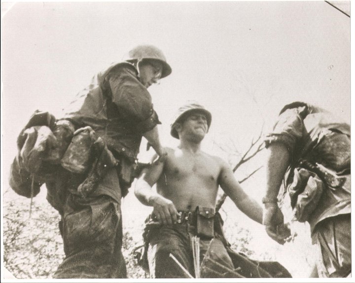 FMF-Doc aiding wounded Marine.